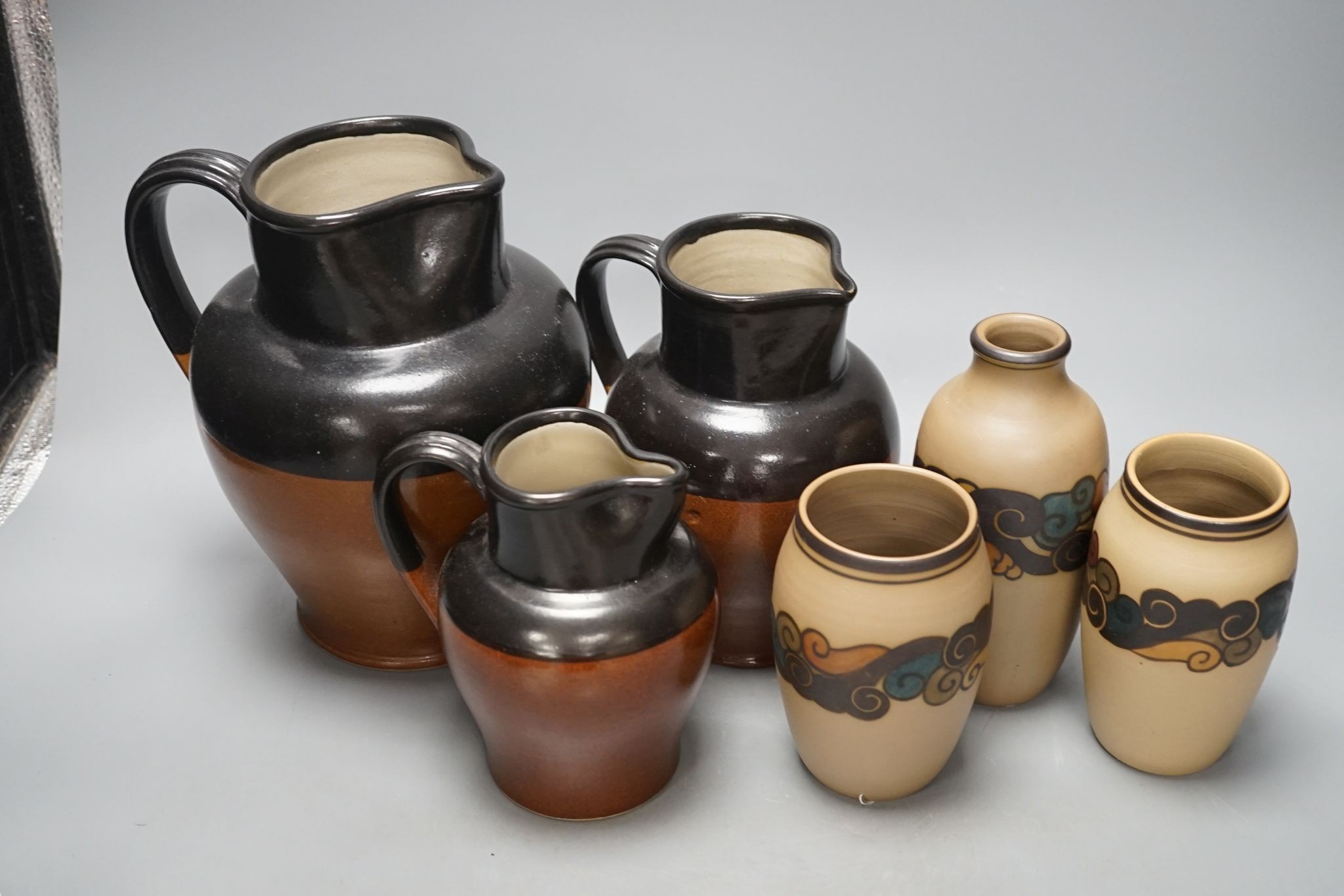 A graduated set of three Bourne Denby stoneware jugs and three 1930's stoneware vases, by Bornholm, Denmark (6)